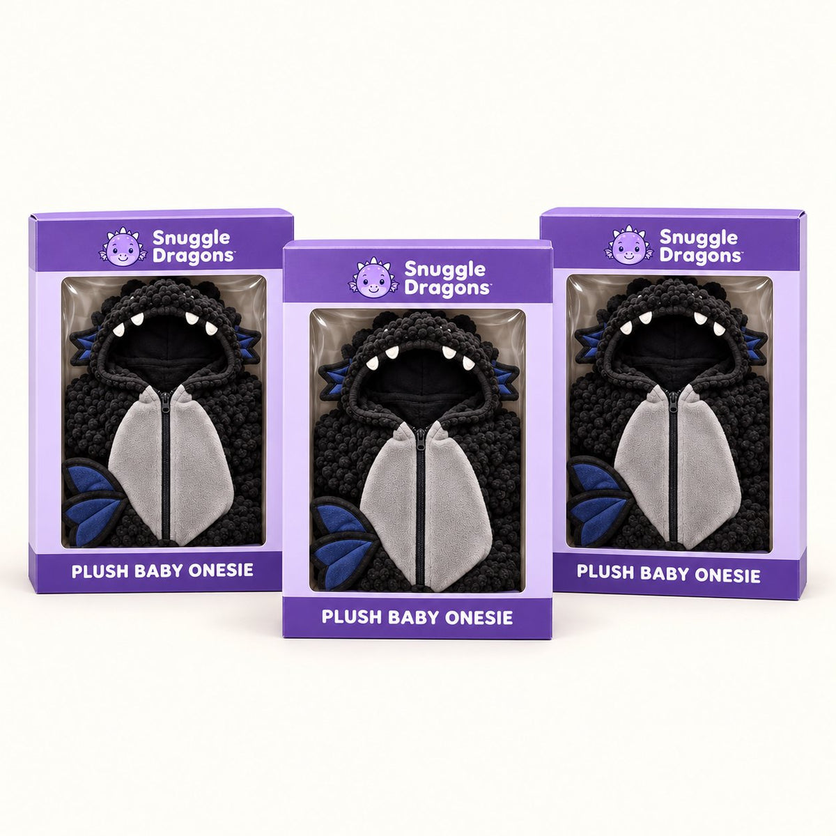 Three Snuggle Dragons onesie boxes